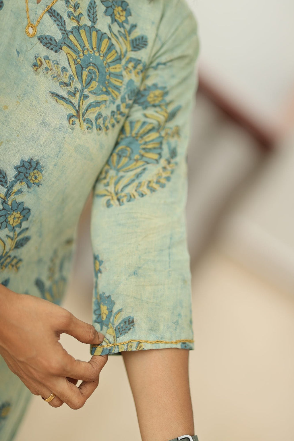 Sleeve and vegetable-dyed cotton fabric close-up