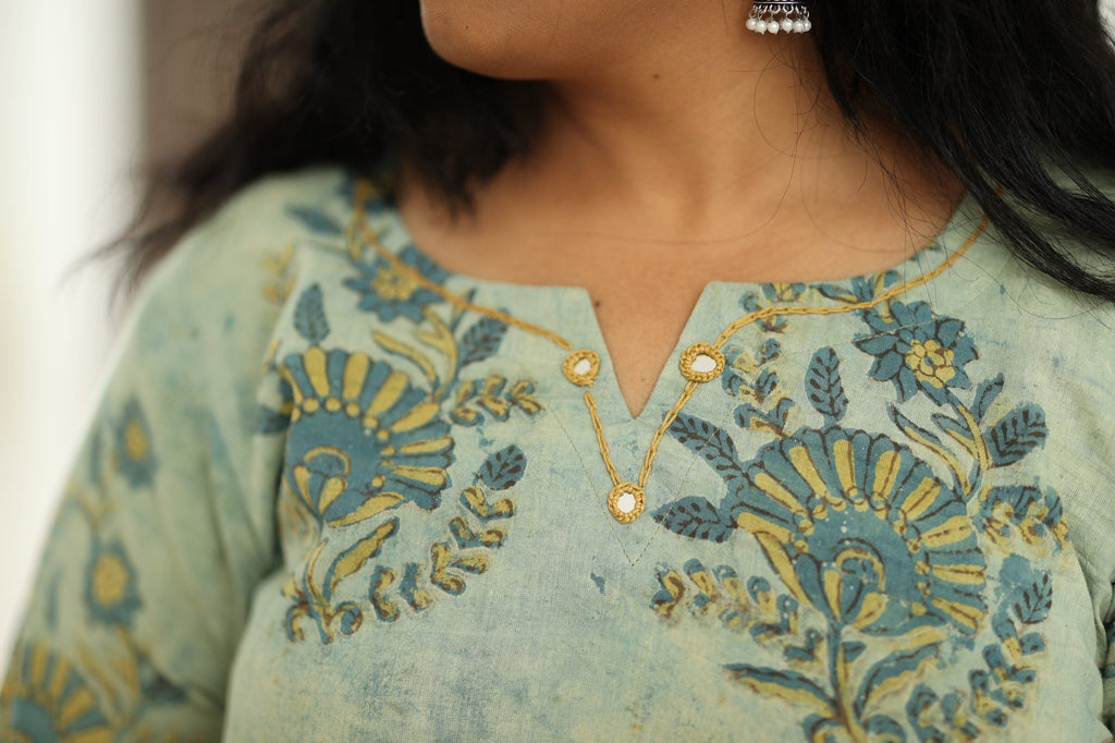 Notch neckline with gold embroidery and mirror buttons
