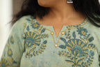 Notch neckline with gold embroidery and mirror buttons