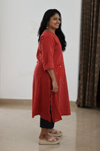 Side view of red striped longline office kurta showing length and slit