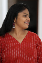 V-neckline and white stripe detail on red office kurta
