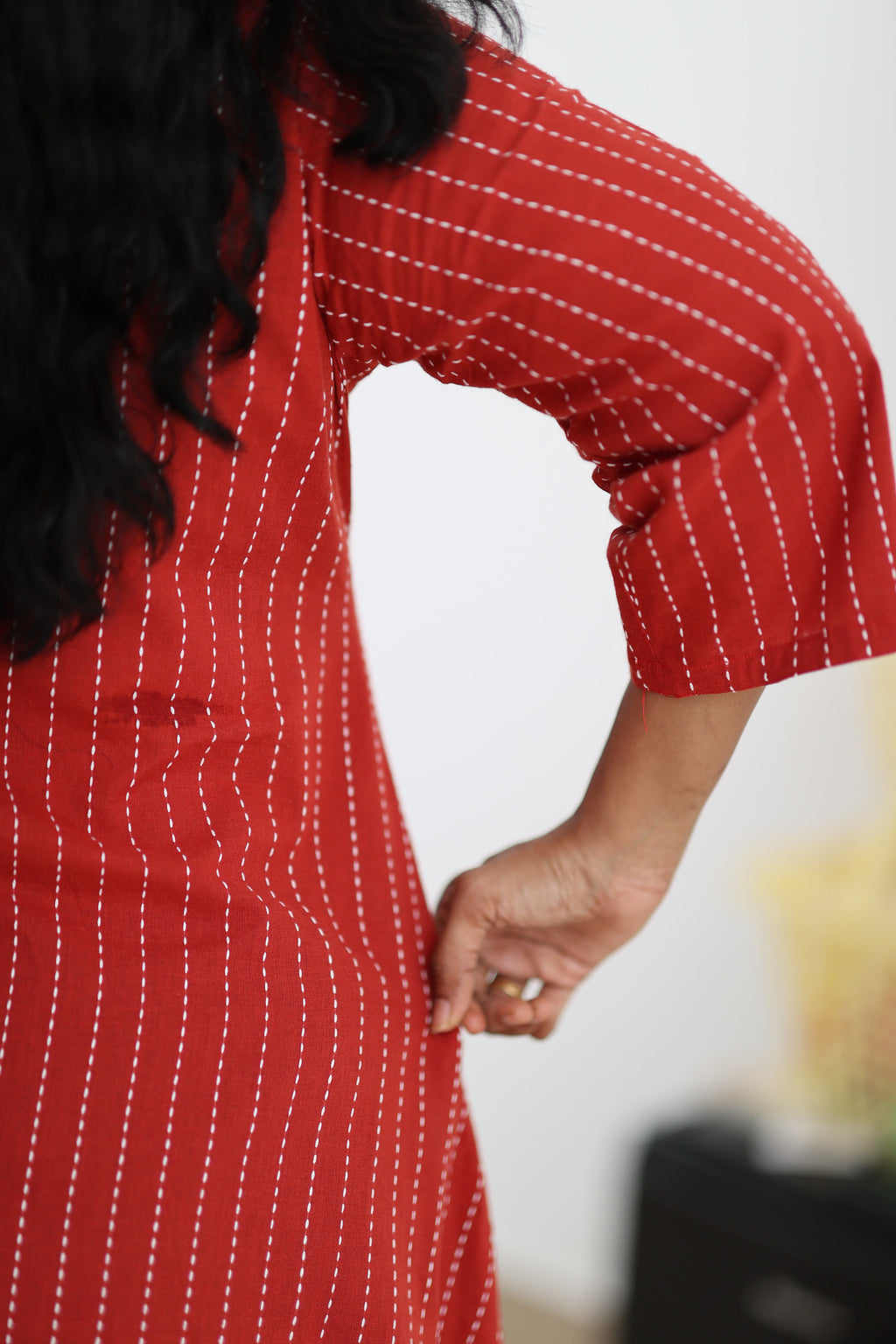 Sleeve movement and side fit of red striped office kurta