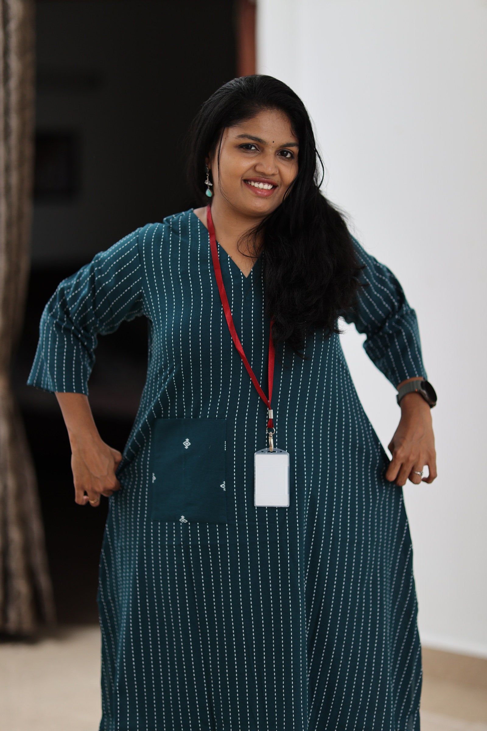 Relaxed front fit of teal striped 30+ office kurta with statement pocket