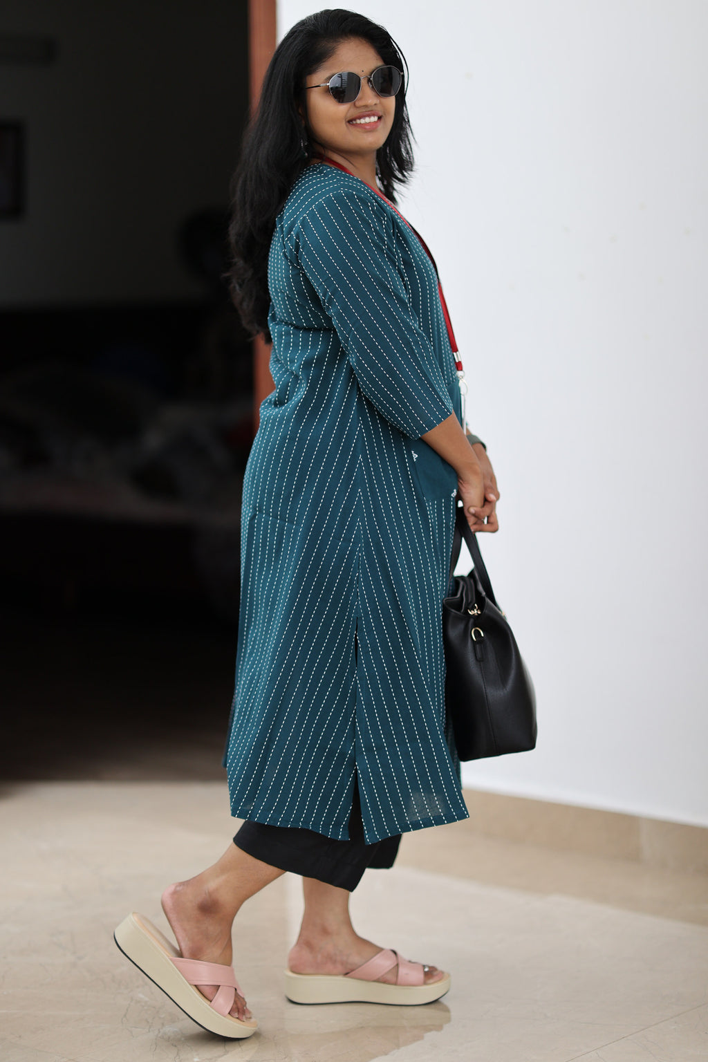 Side fit and longline length of teal striped 30+ office kurta