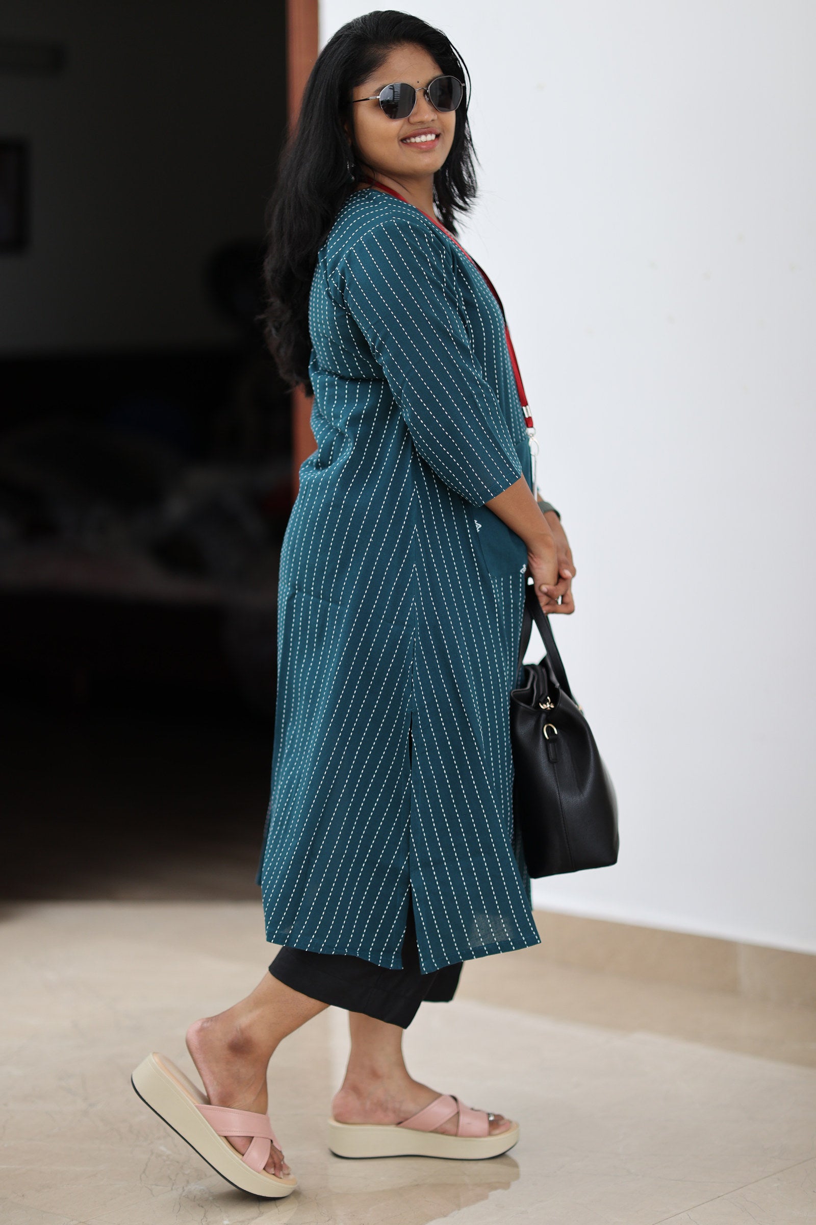 Side fit and longline length of teal striped 30+ office kurta