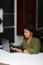 Olive striped 30+ kurta worn for laptop desk work