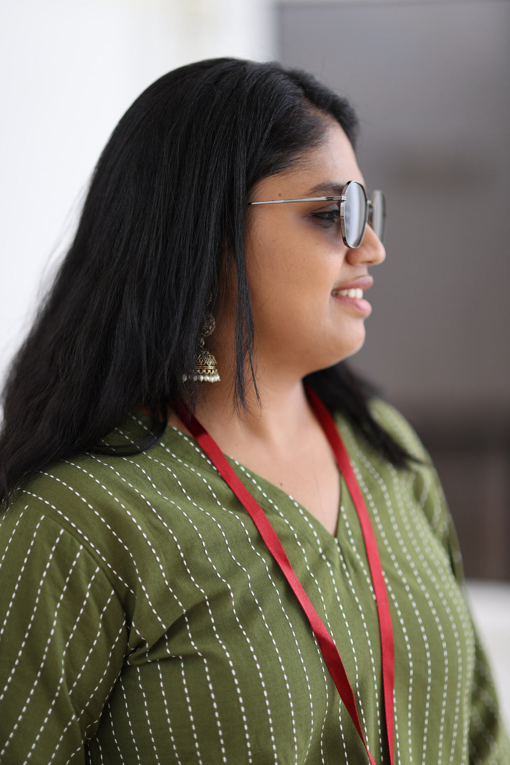 V-neck and white stripe detail on olive 30+ office kurta