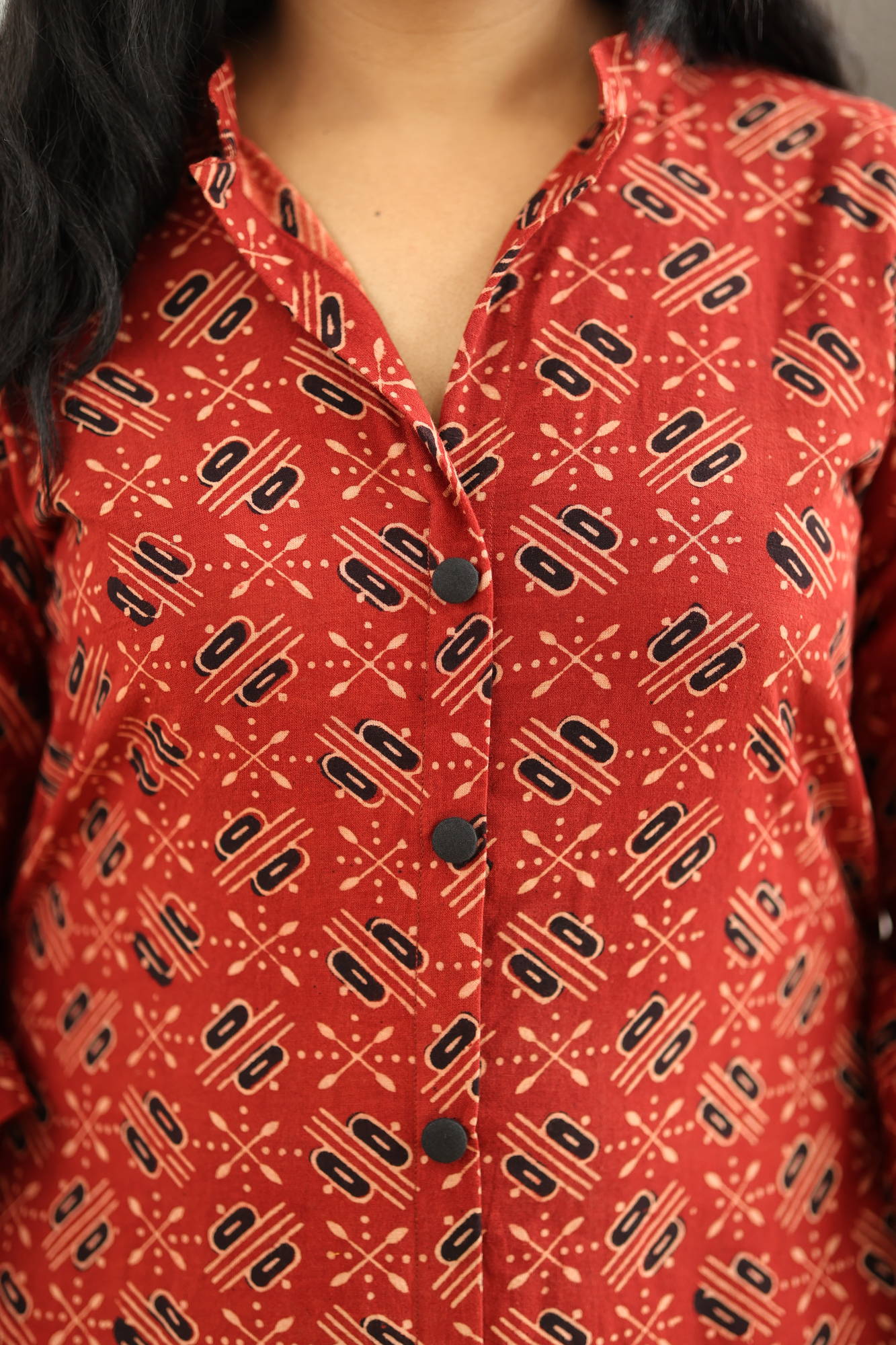 Stand collar and covered black button placket