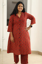 Madder red Ajrakh kurta set, hand on hip