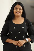 Black embroidered kurta, upper body close-up