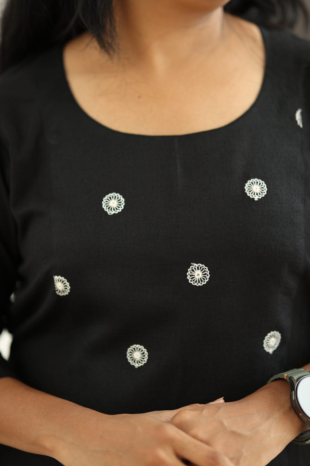 Round neck and white embroidered floral motifs