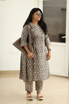Grey dabu kurta set, styled with a bag