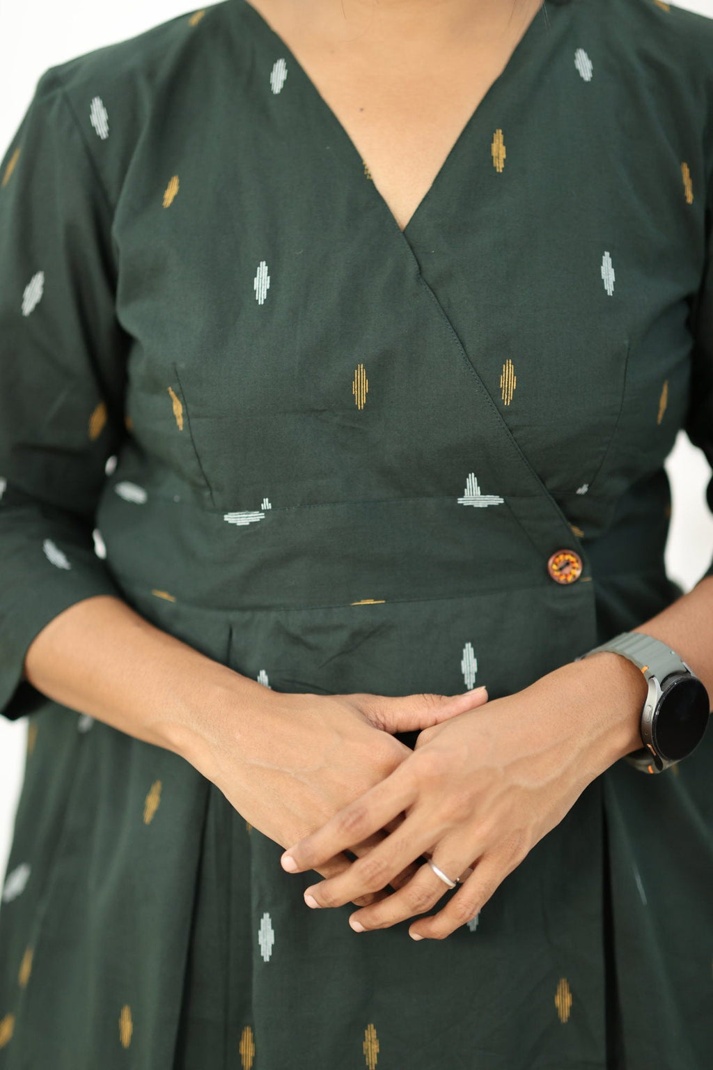 V-neck wrap front with the wooden waist button