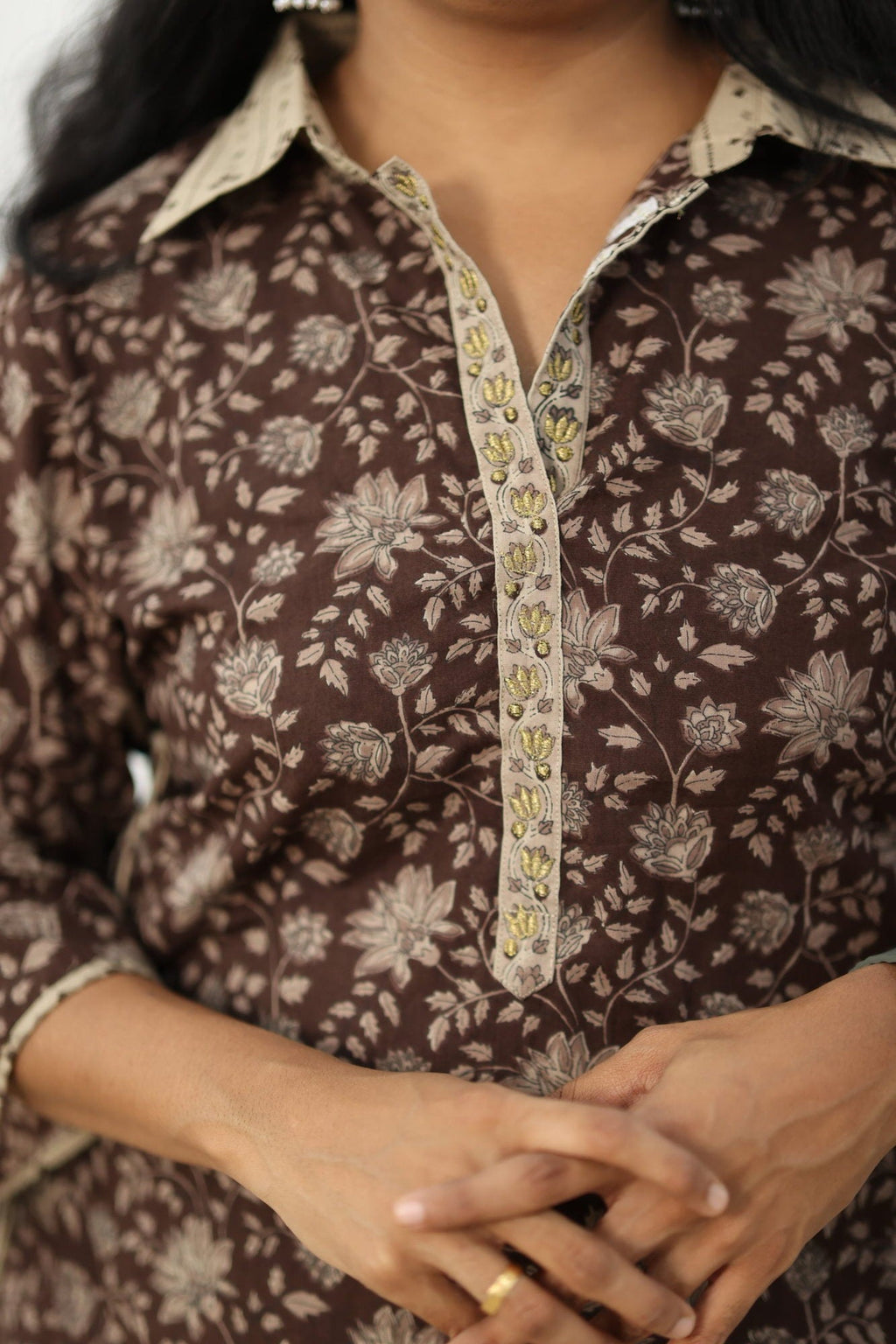 Contrast beige collar and the gold zari embroidered placket