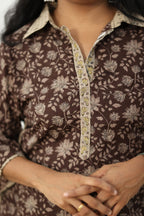 Contrast beige collar and the gold zari embroidered placket