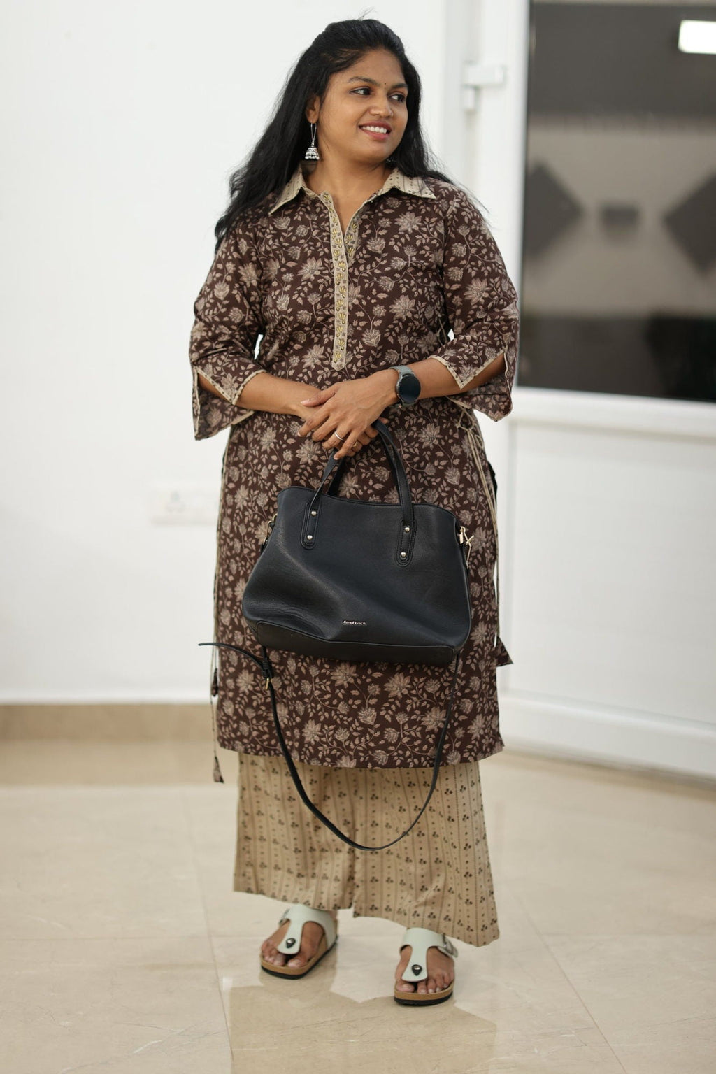 Styled for a work day with a black bag