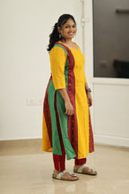 Mustard woven border kurta set, side view showing the contrast panels