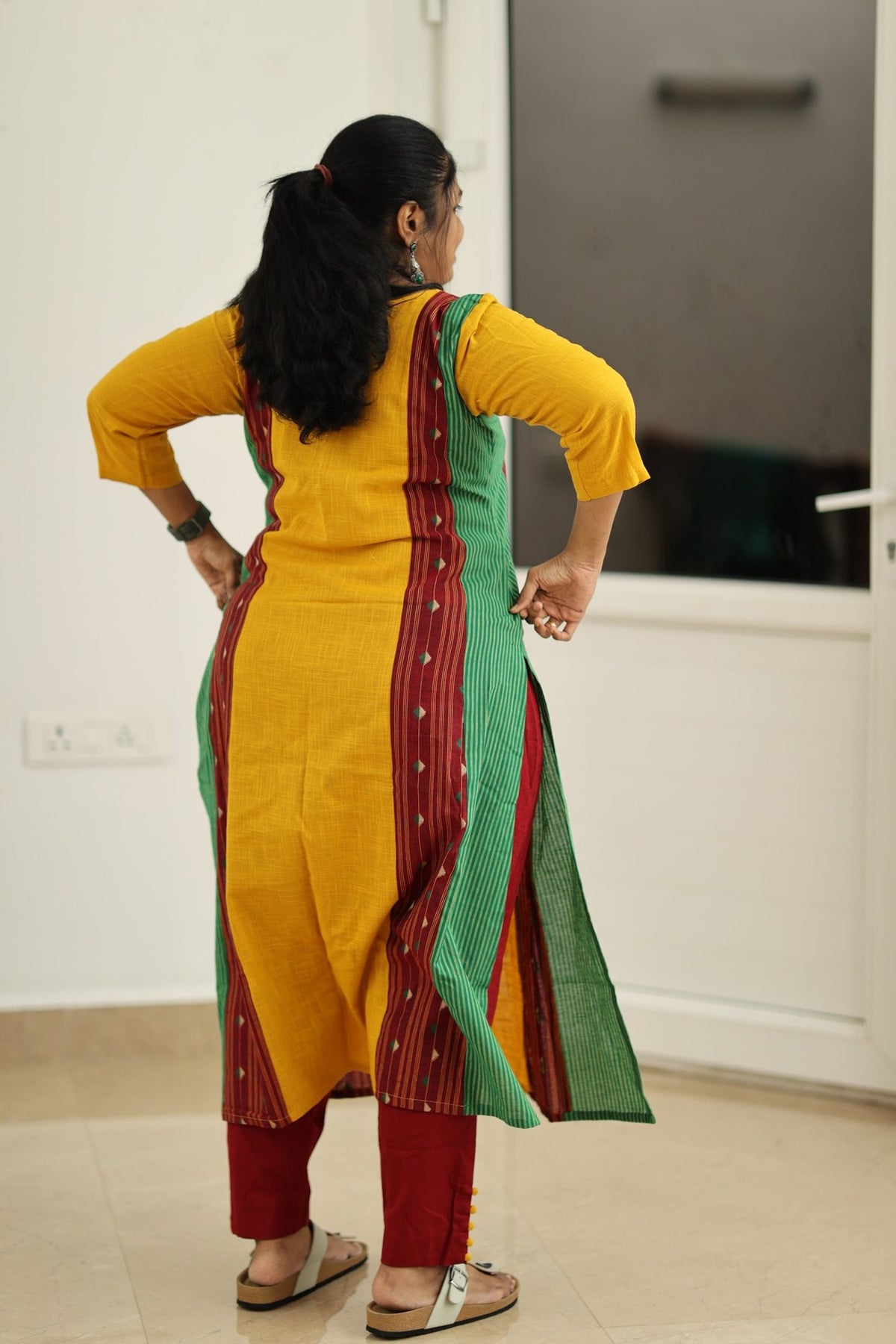 Back view of the mustard woven border kurta set