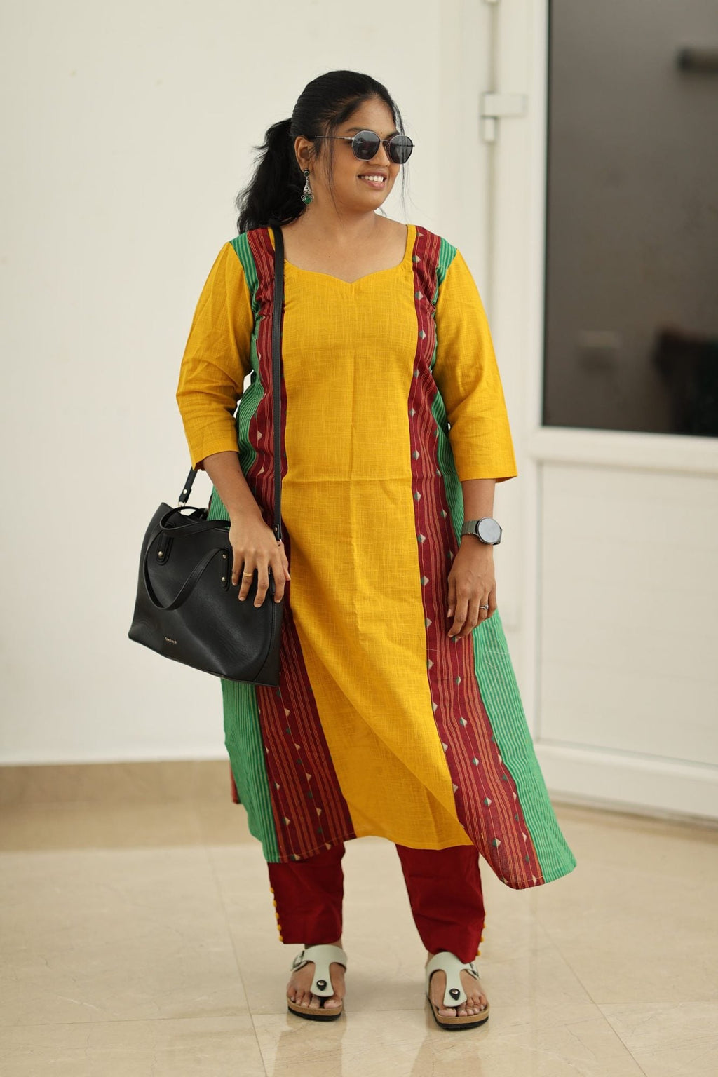 Styled with a black handbag for the office