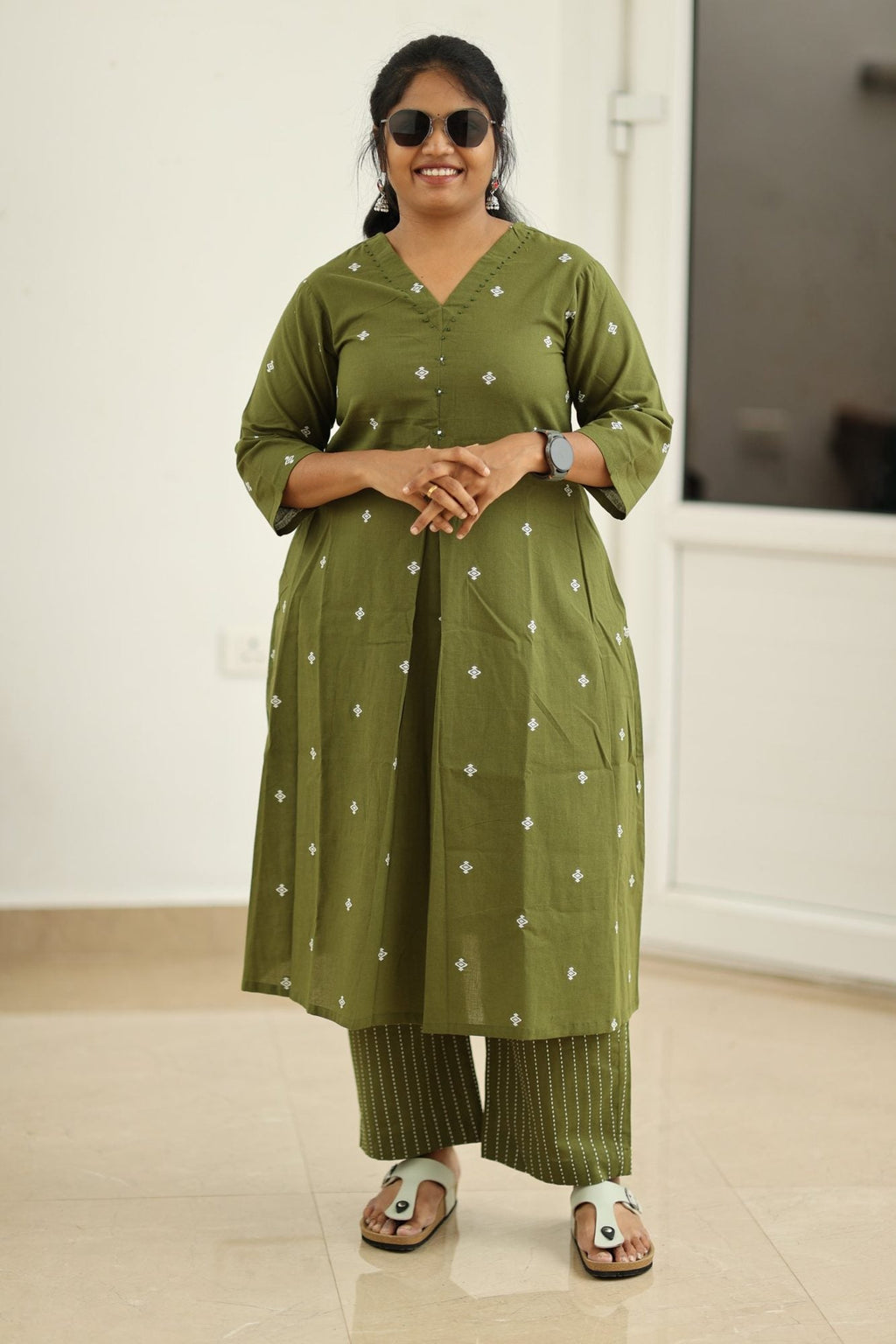 Royal olive kurta set styled with sunglasses