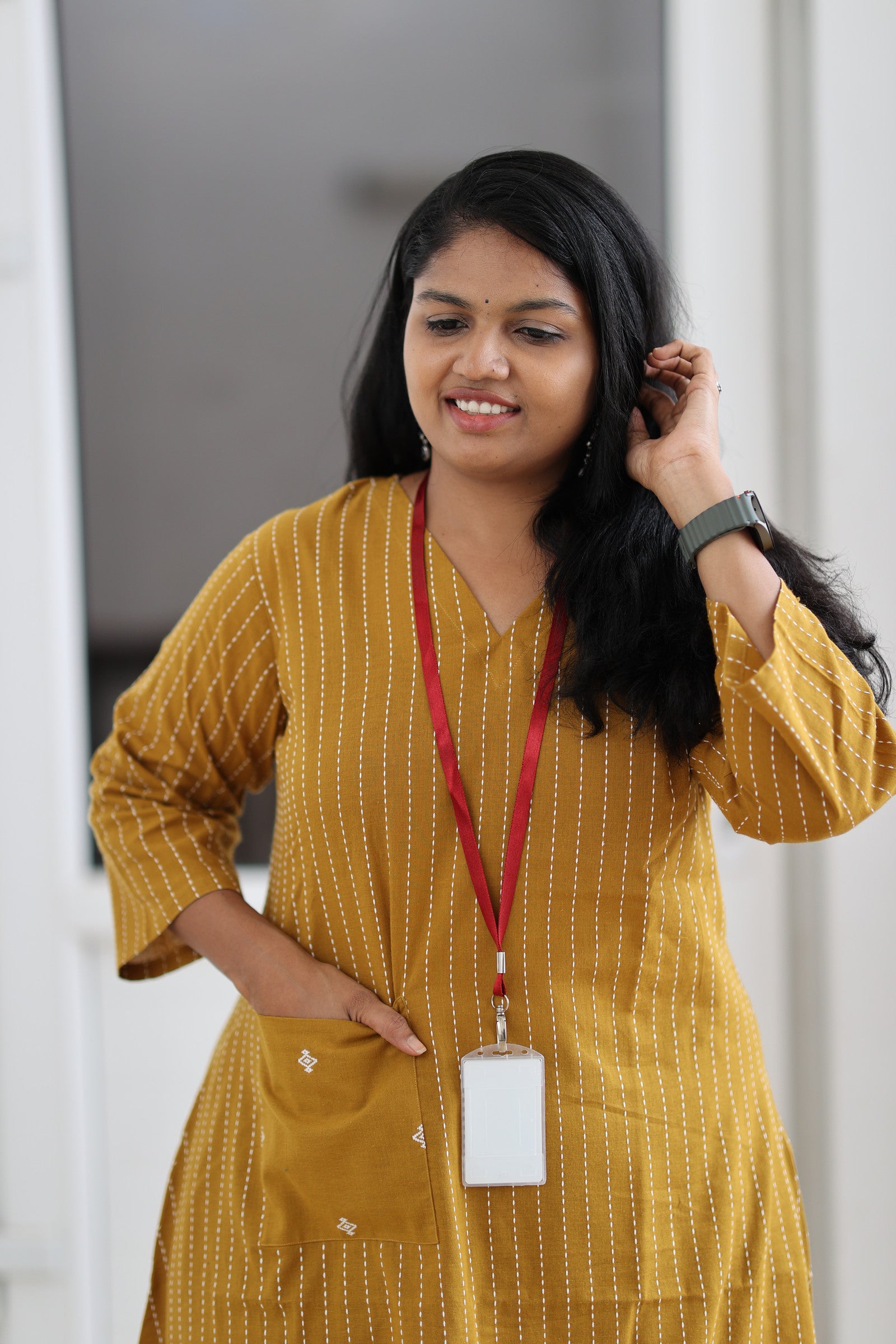 Front fit and statement pocket of mustard striped 30+ office kurta